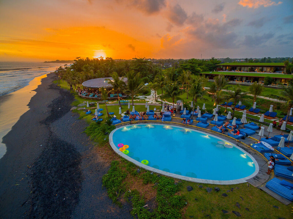 Komune Beach Club Keramas: Minimum Spend, Pool and Night Surf